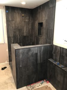 Black tile surround shower, half wall & separate tub w claw foot